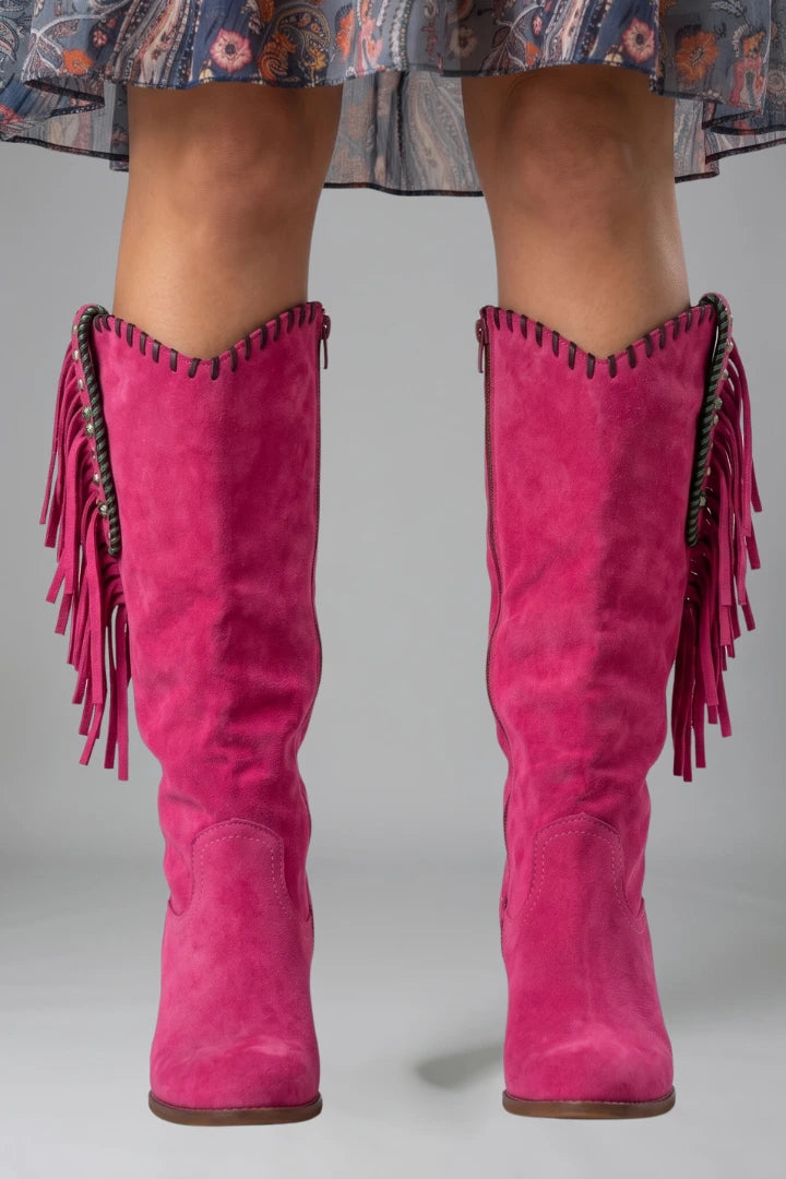 Woman wearing pink orthopedic block heel boots - studio photo