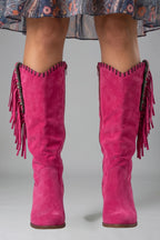Woman wearing pink orthopedic block heel boots - studio photo