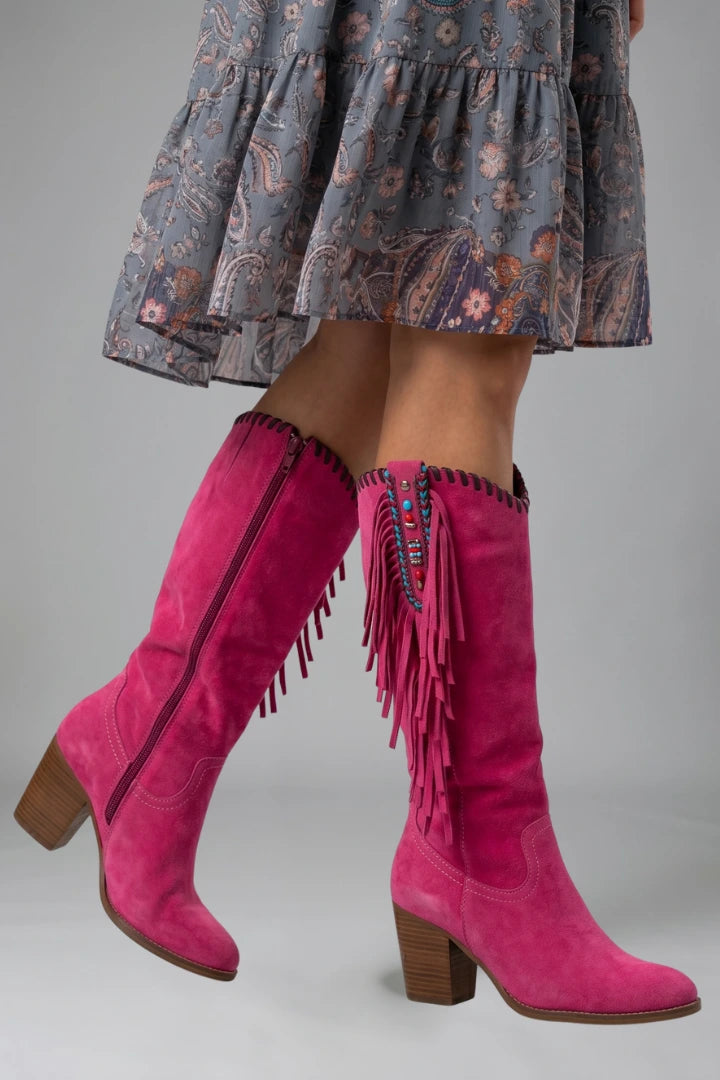 Woman wearing pink orthopedic block heel boots - studio photo