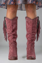 Woman wearing purple orthopedic block heel boots - studio photo