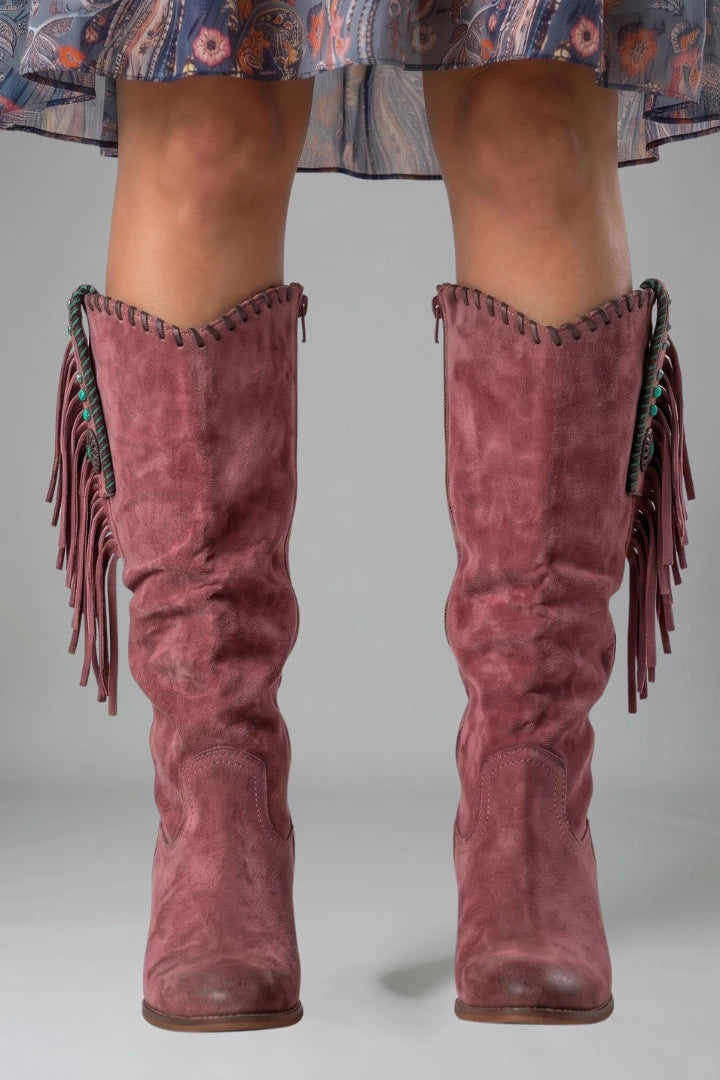 Woman wearing purple orthopedic block heel boots - studio photo
