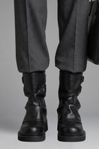Woman wearing black side buckle accent fall boots - lifestyle photo