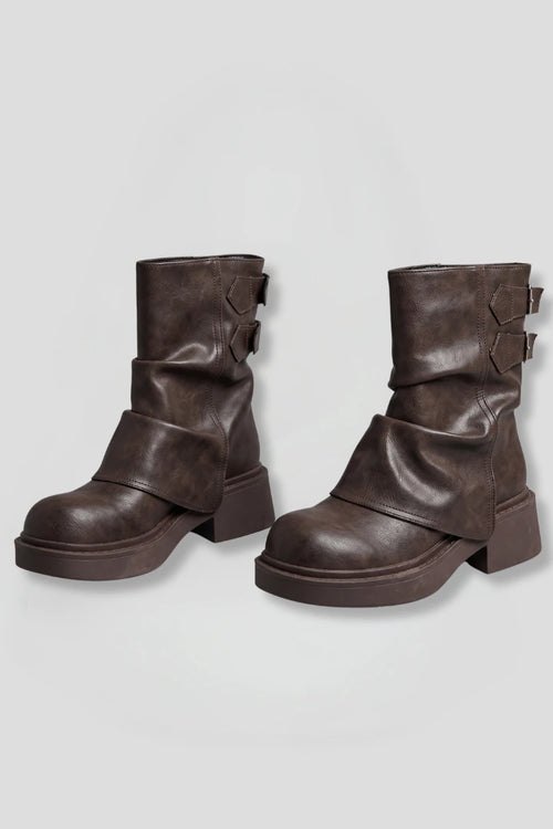 Woman wearing brown side buckle accent fall boots - studio photo