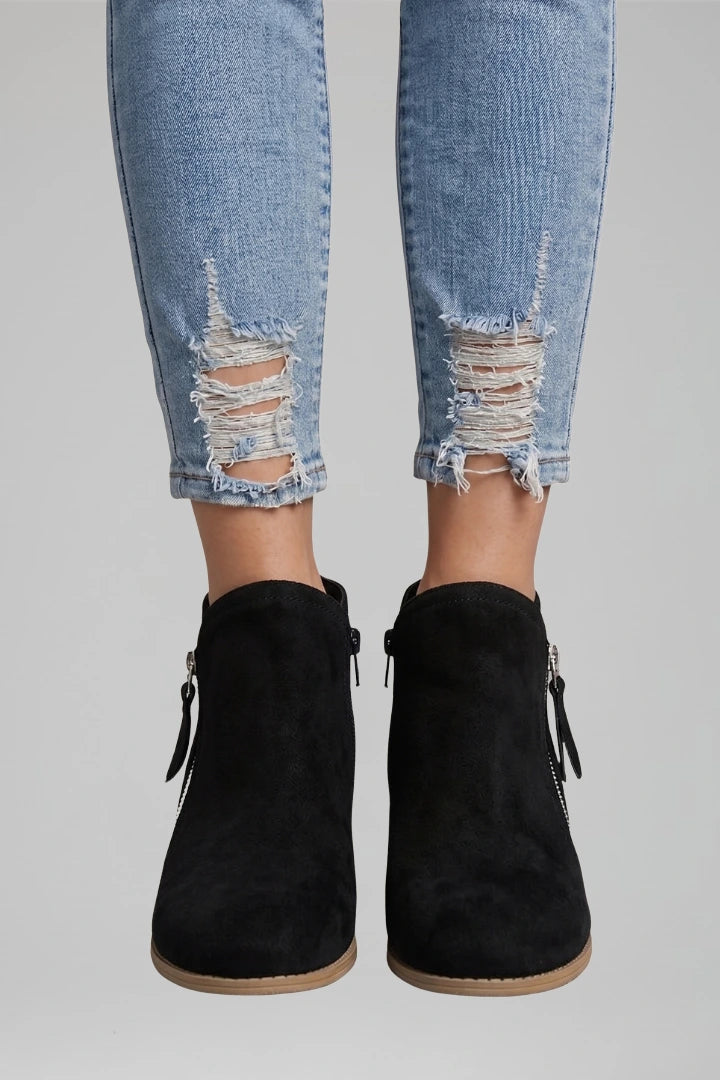 Woman wearing black suede side zipper ankle boots - lifestyle photo