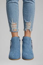 Woman wearing blue suede side zipper ankle boots - lifestyle photo