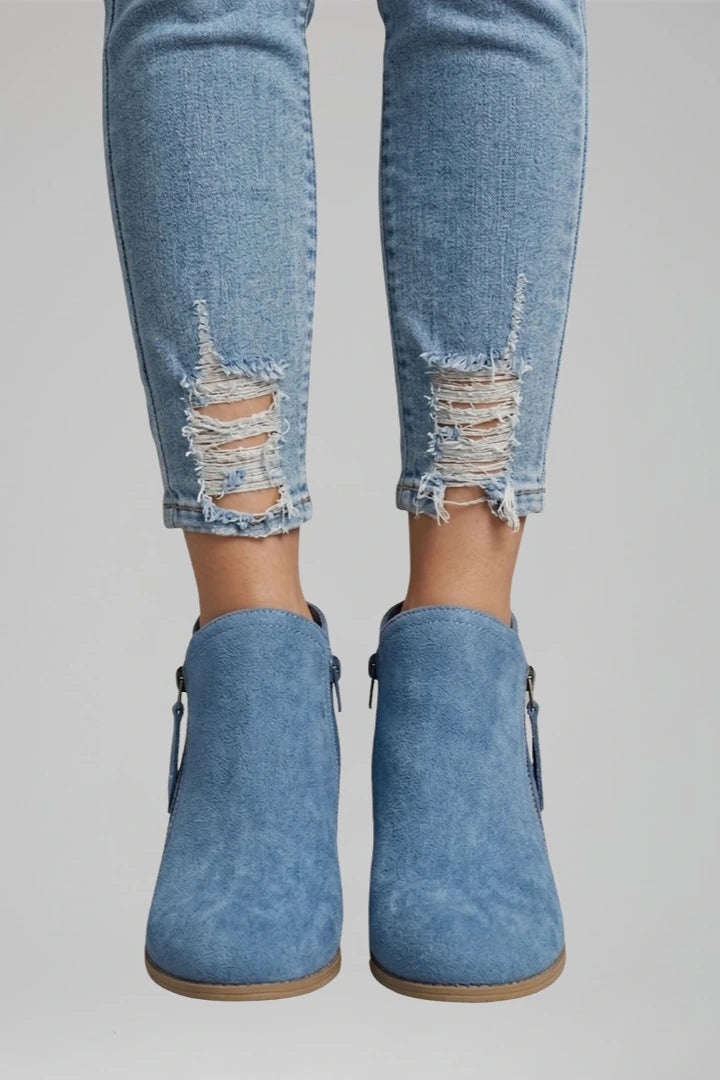 Woman wearing blue suede side zipper ankle boots - lifestyle photo