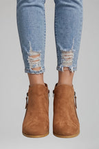 Woman wearing orange suede side zipper ankle boots - lifestyle photo