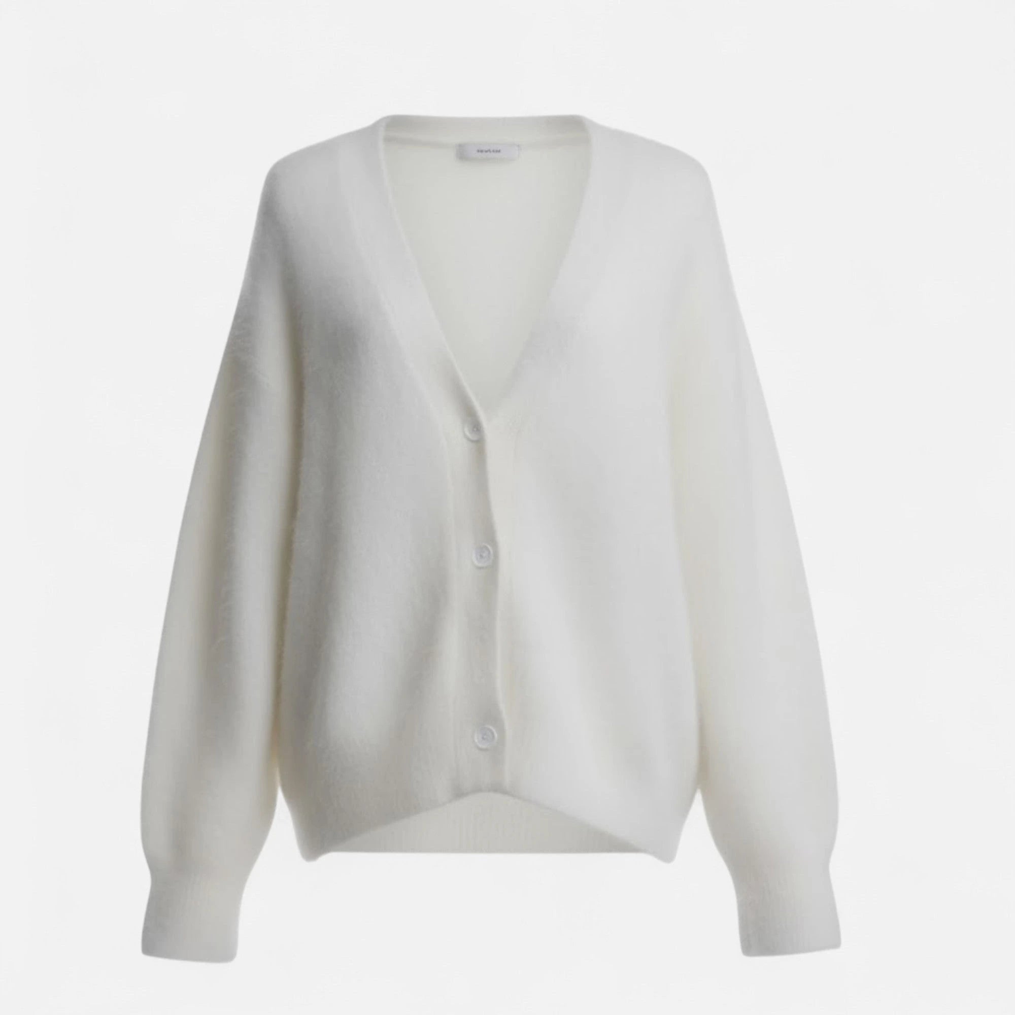 White knit cardigan, close-up on model