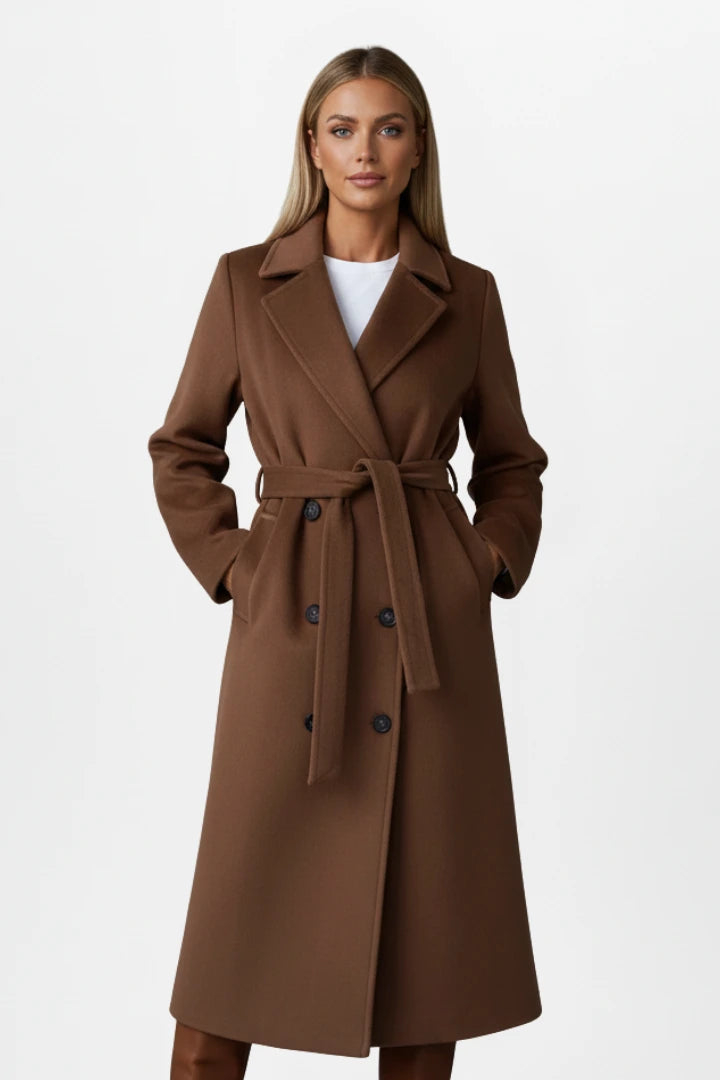 Woman wearing a brown double-breasted belted long coat - studio photo