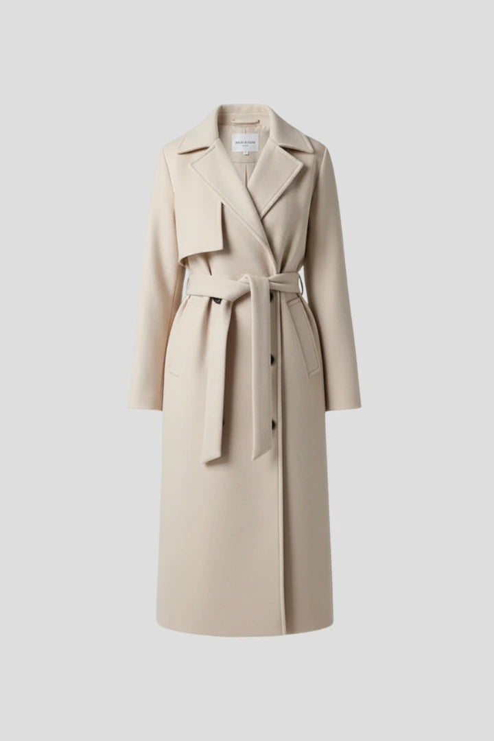 Woman wearing a cream double-breasted belted long coat - studio photo