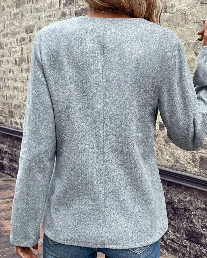Driftly grey knitted coat with contrast black trim, back view