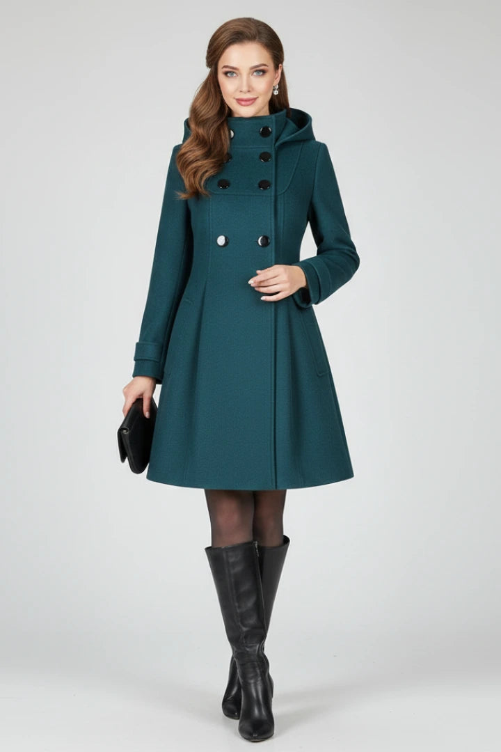 Woman wearing a green hooded double button-front coat - studio photo