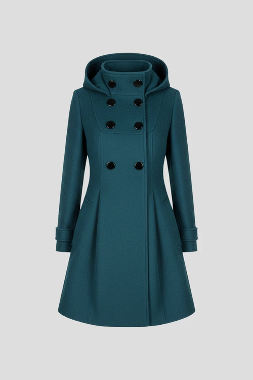 Woman wearing a green hooded double button-front coat - studio photo