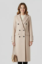 Woman wearing a beige lapel collar button-down coat - studio photo