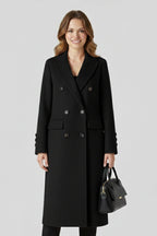 Woman wearing a black lapel collar button-down coat - studio photo