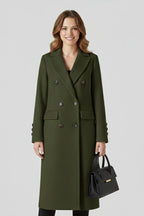 Woman wearing a khaki lapel collar button-down coat - studio photo