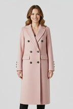 Woman wearing a pink lapel collar button-down coat - studio photo
