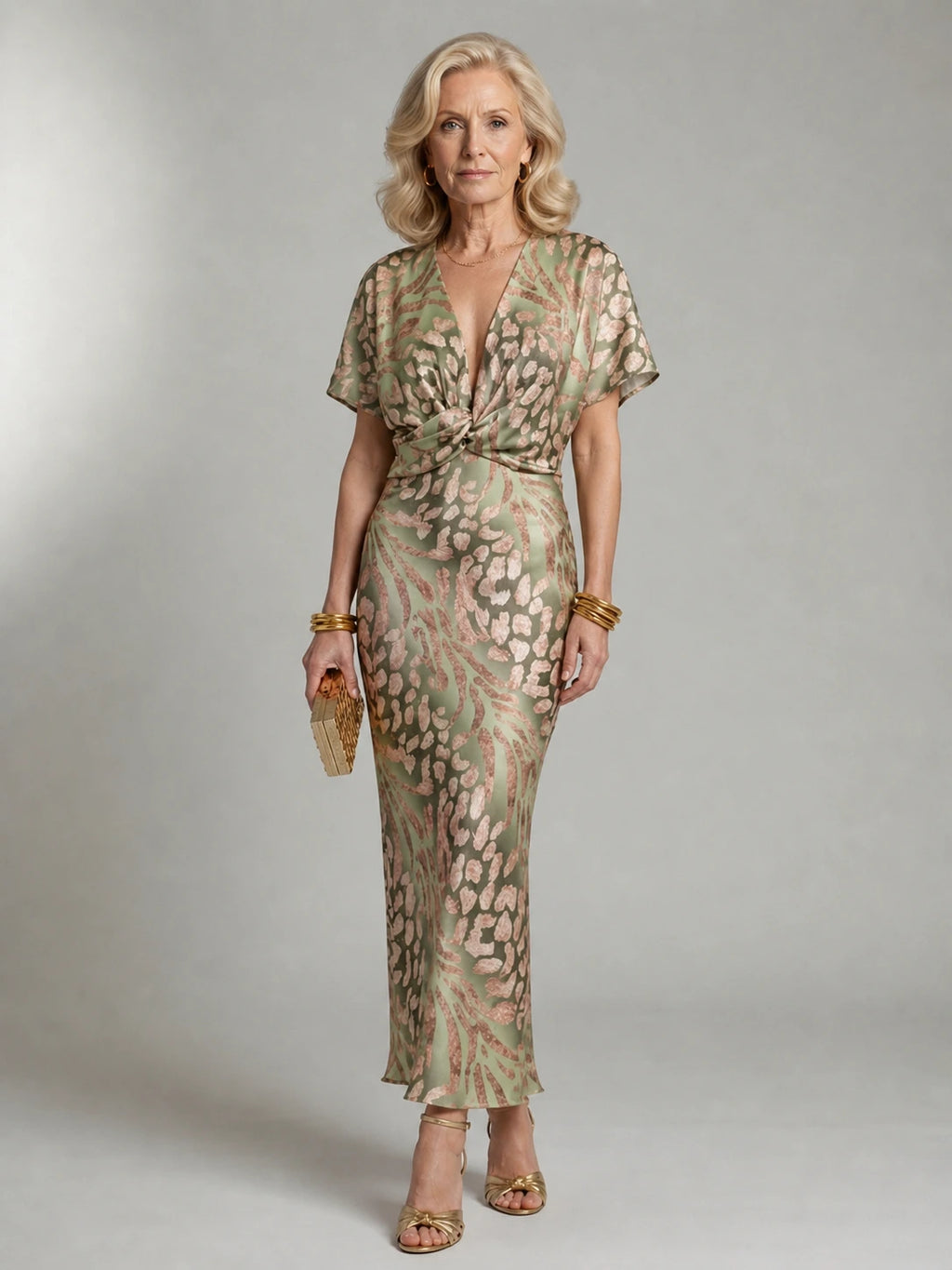 Woman wearing a green abstract print v-neck twist-waist midi dress - studio photo
