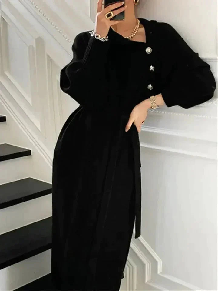 Black turtleneck sweater dress with tie waist, front view