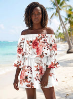 Woman wearing a white floral off-shoulder mini dress on a tropical beach
