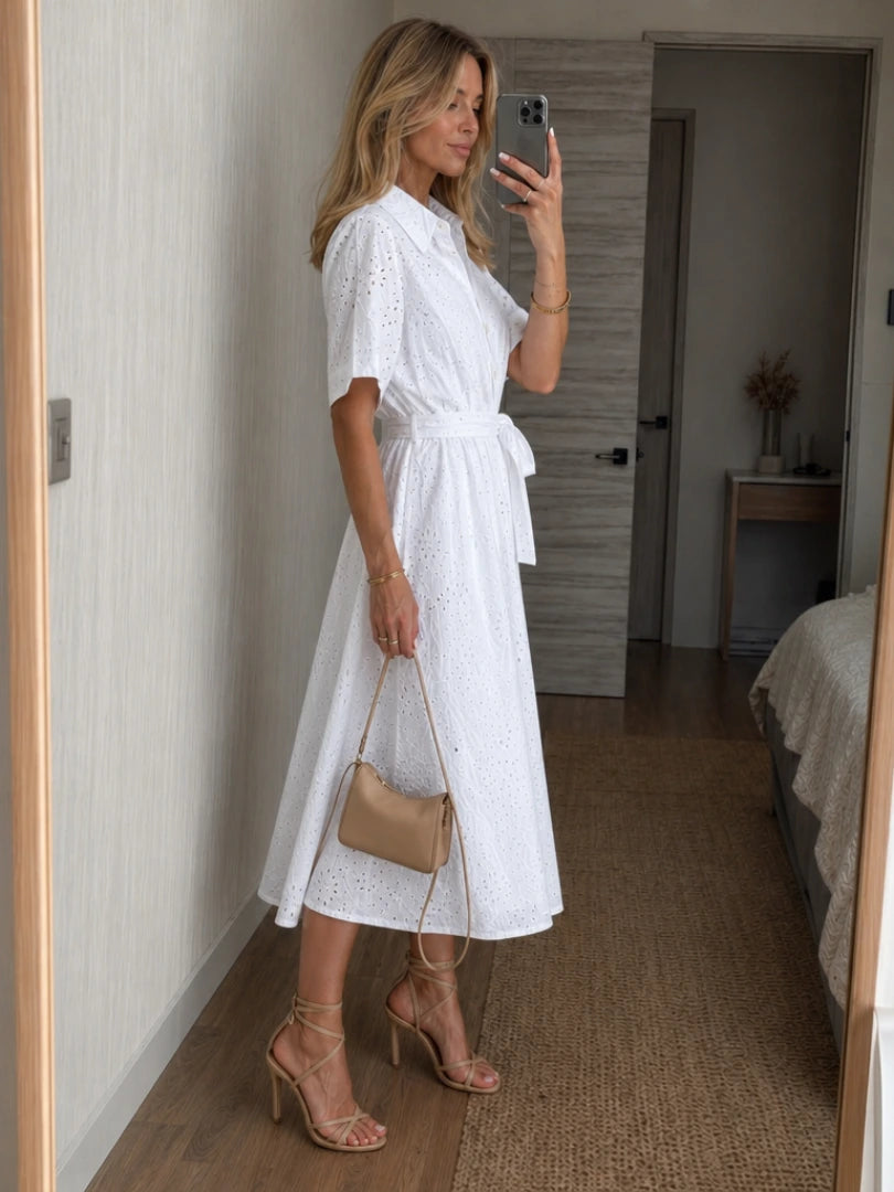 Woman wearing a white button-front waist tie midi dress - lifestyle photo