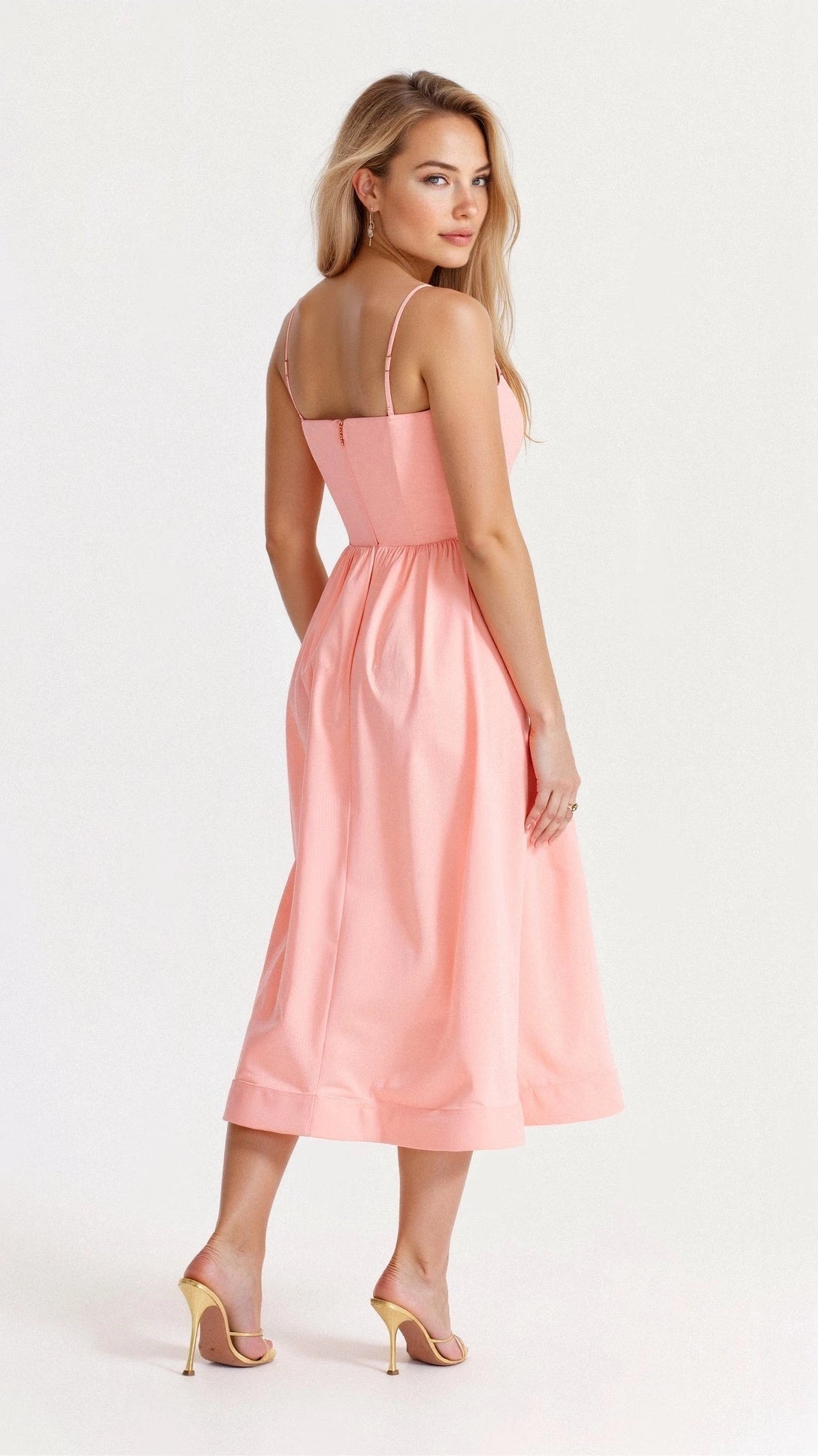 Woman wearing a pink classic midi dress - studio photo