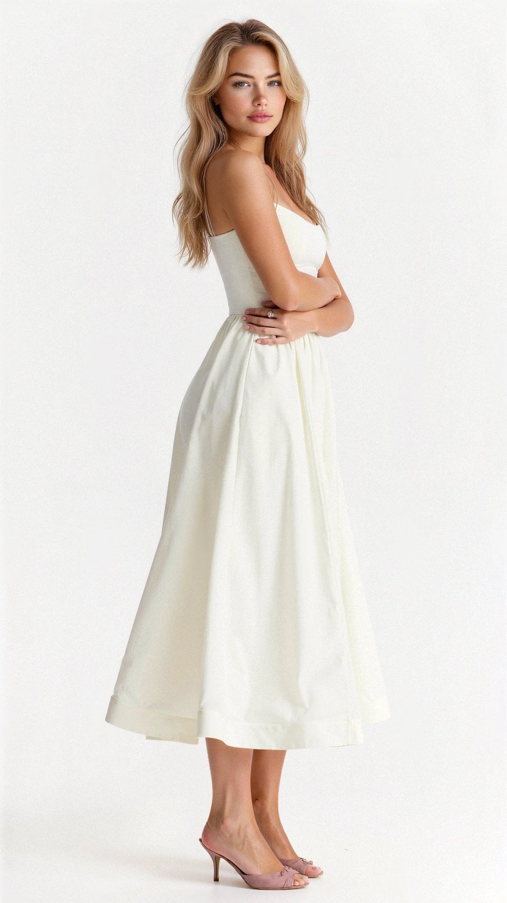 Woman wearing a white classic midi dress - studio photo