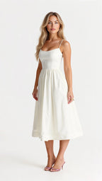 Woman wearing a white classic midi dress - studio photo