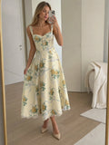 Woman wearing a beige corset style structured bodice midi dress - studio photo