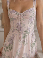 Woman wearing a pink corset style structured bodice midi dress - studio photo