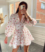 Woman wearing a pink crochet lace balloon sleeve mini dress - mirror selfie style photo
