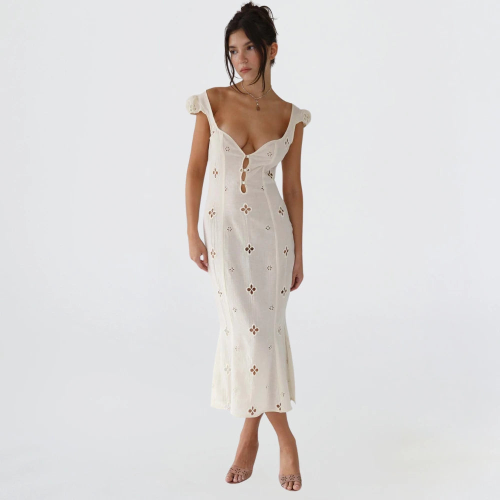 Woman wearing a white cut-out fitted midi dress - studio photo