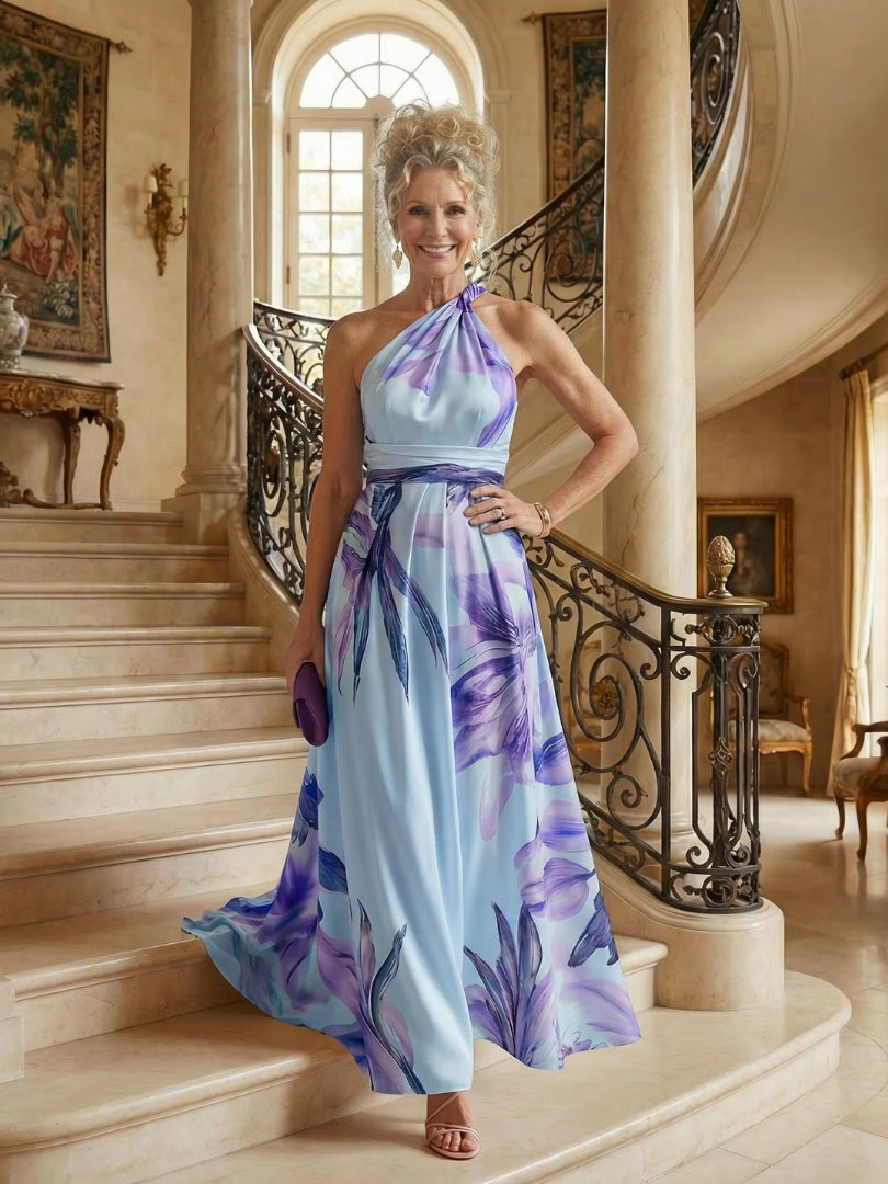 Woman wearing a purple floral halter tie-neck maxi dress - editorial style photo