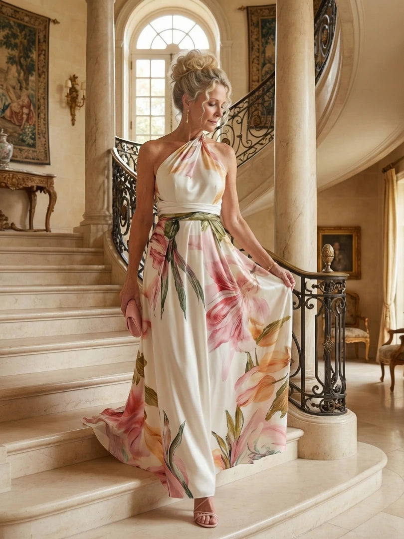 Woman wearing a purple floral halter tie-neck maxi dress - editorial style photo