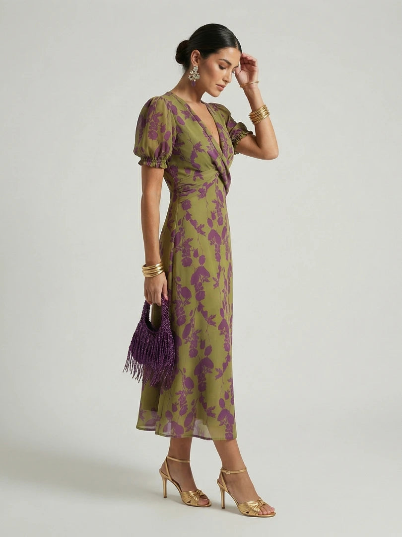 Woman wearing a floral relaxed midi dress - studio photo