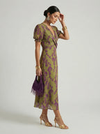 Woman wearing a floral relaxed midi dress - studio photo