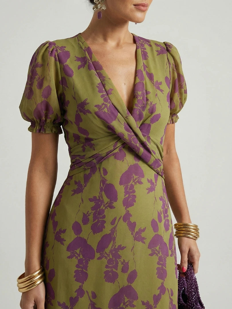 Woman wearing a floral relaxed midi dress - studio photo
