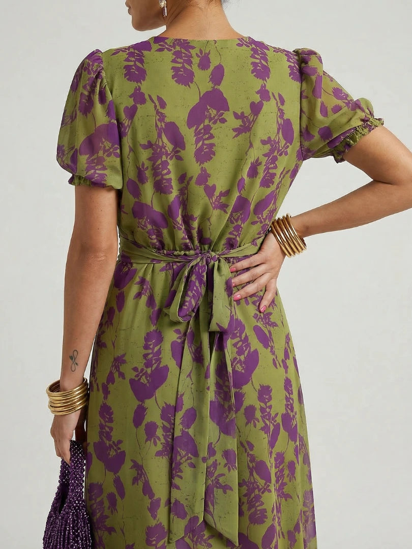 Woman wearing a floral relaxed midi dress - studio photo
