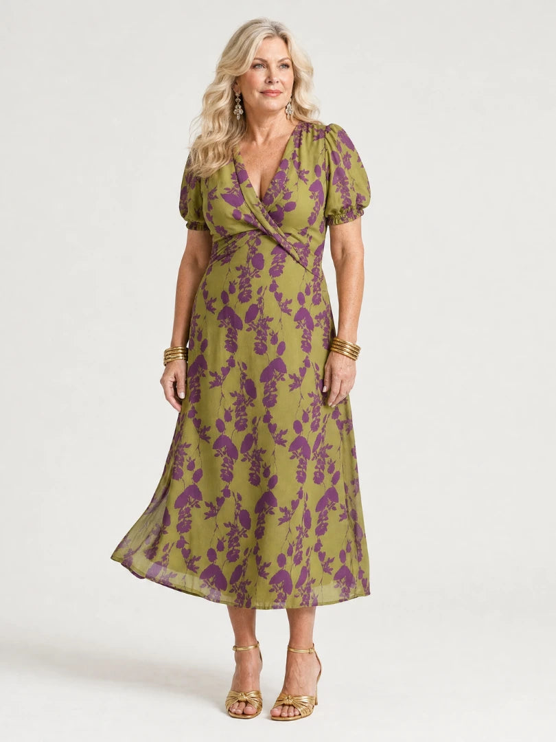 Woman wearing a floral relaxed midi dress - studio photo