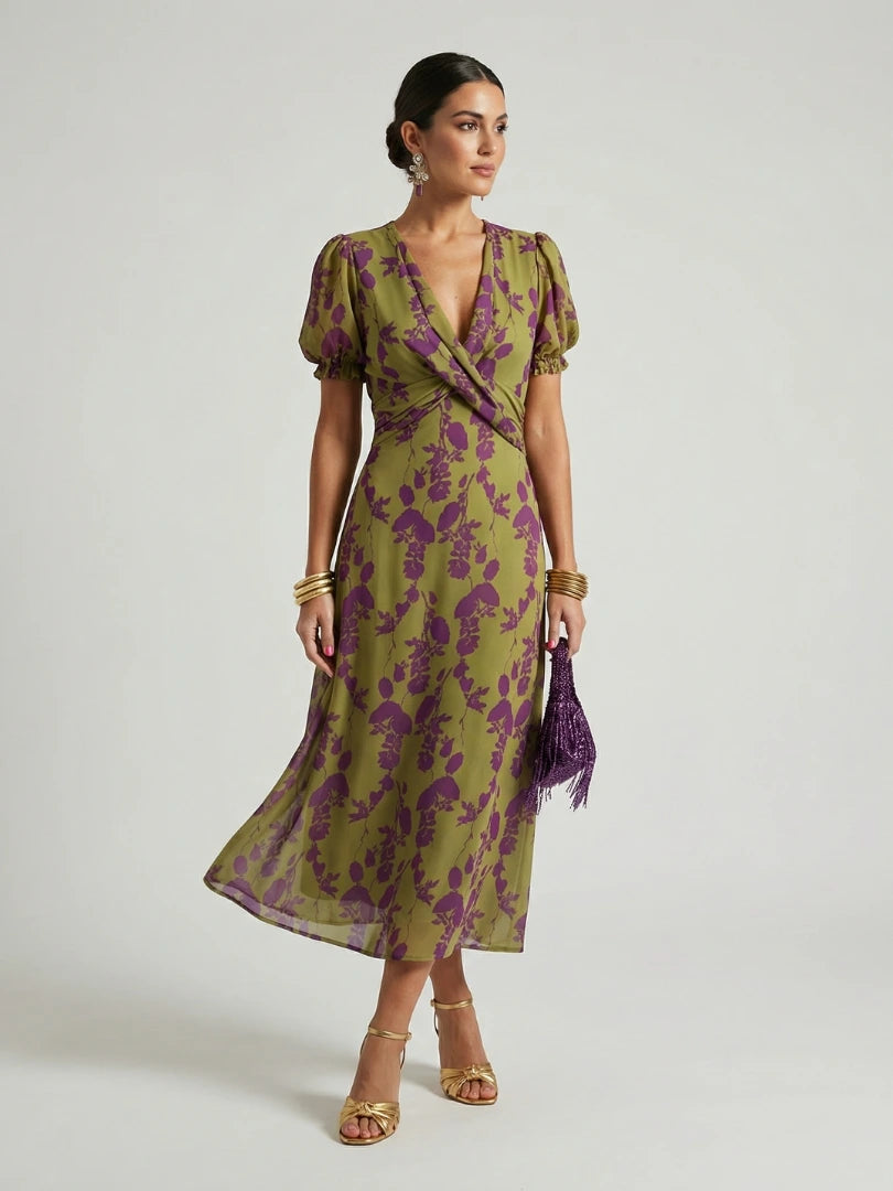 Woman wearing a floral relaxed midi dress - studio photo