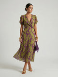 Woman wearing a floral relaxed midi dress - studio photo