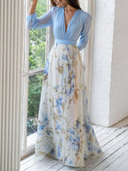 Woman wearing a sky blue floral sheer maxi dress - lifestyle photo