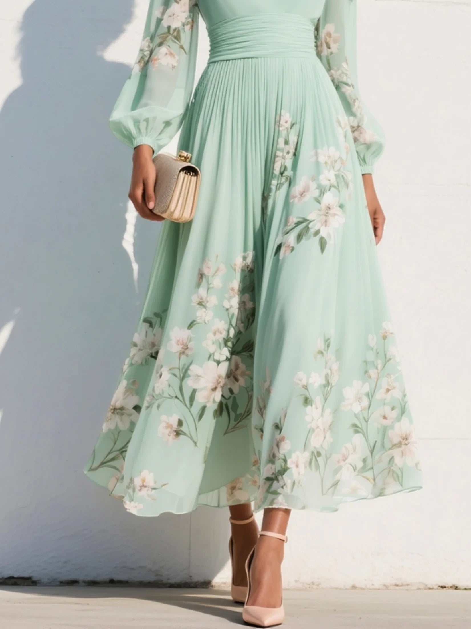 Woman wearing a light green floral v-neck chiffon midi dress - lifestyle photo