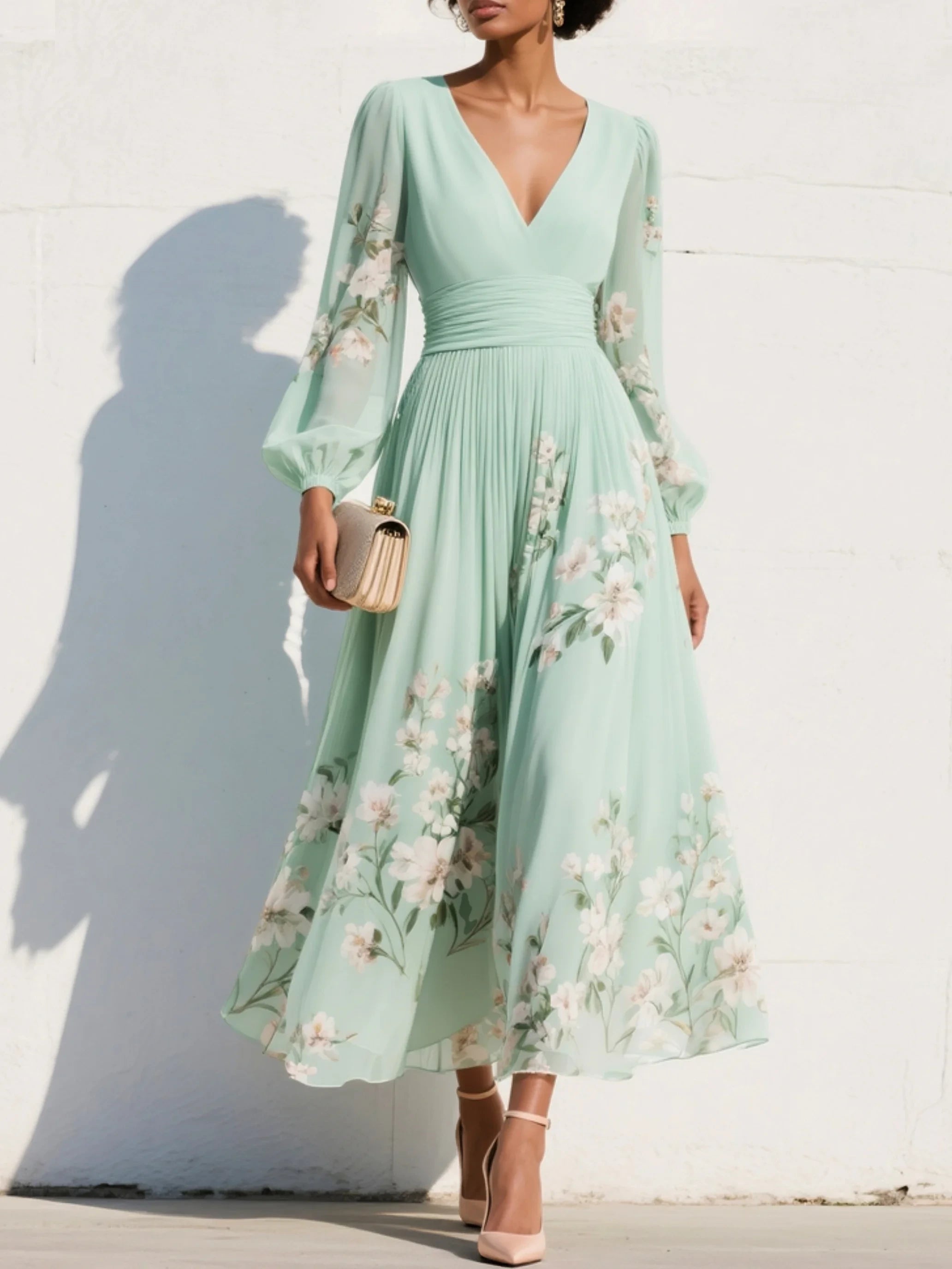 Woman wearing a light green floral v-neck chiffon midi dress - studio photo