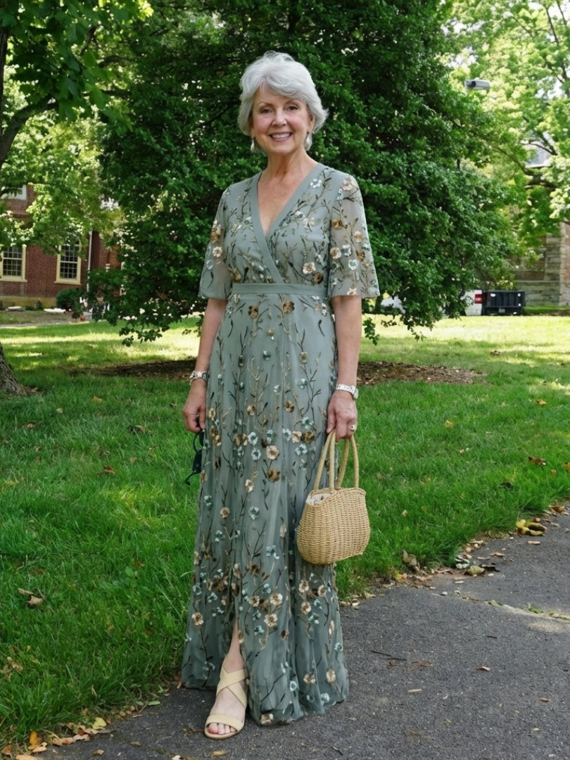 Woman wearing a green floral v-neck elbow-sleeve maxi dress - lifestyle photo