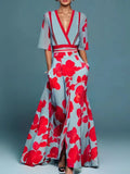 Woman wearing a red floral v-neck elegant dress - studio photo