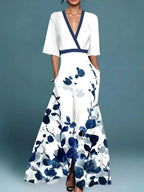 Woman wearing a white floral v-neck elegant dress - studio photo