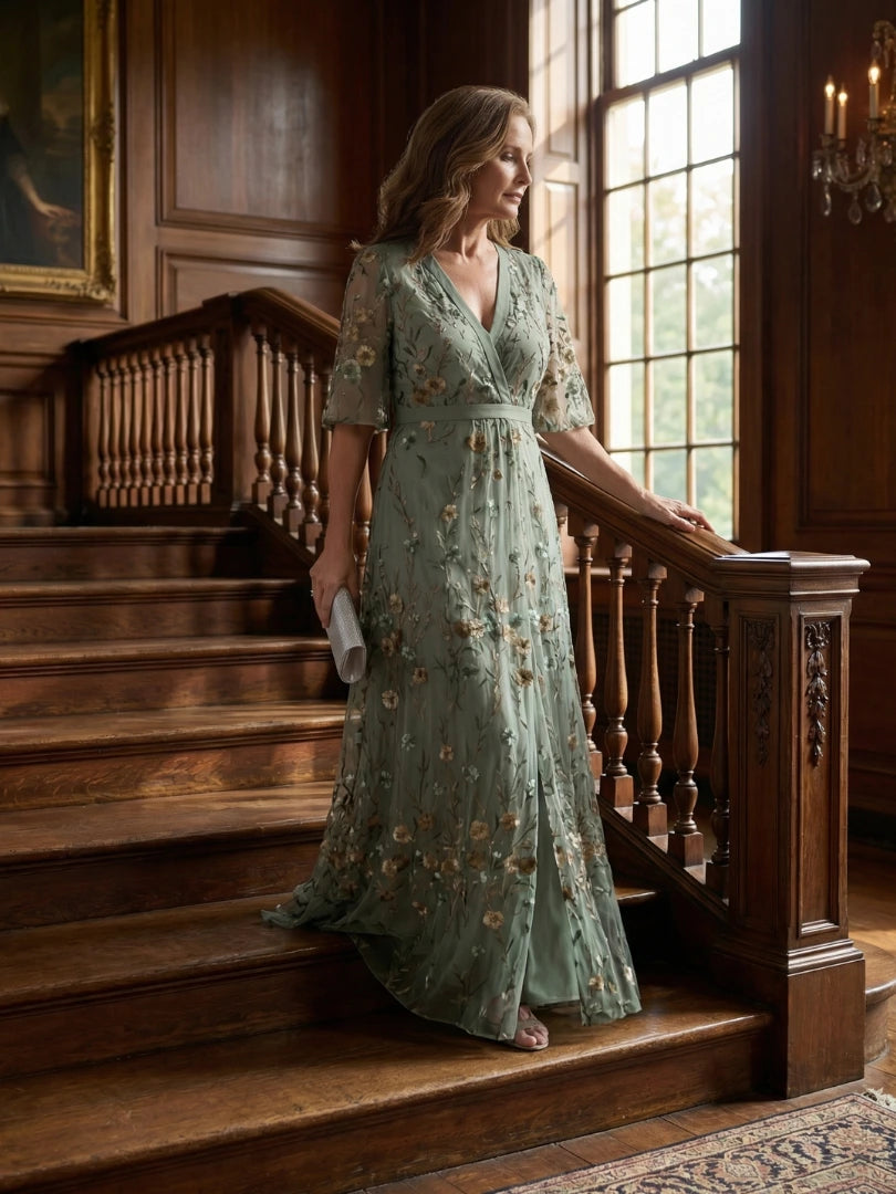 Woman wearing a sage green floral wrap flutter sleeve maxi dress - editorial style photo