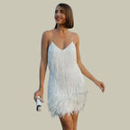 Woman wearing a white fringe hem mini dress - studio photo