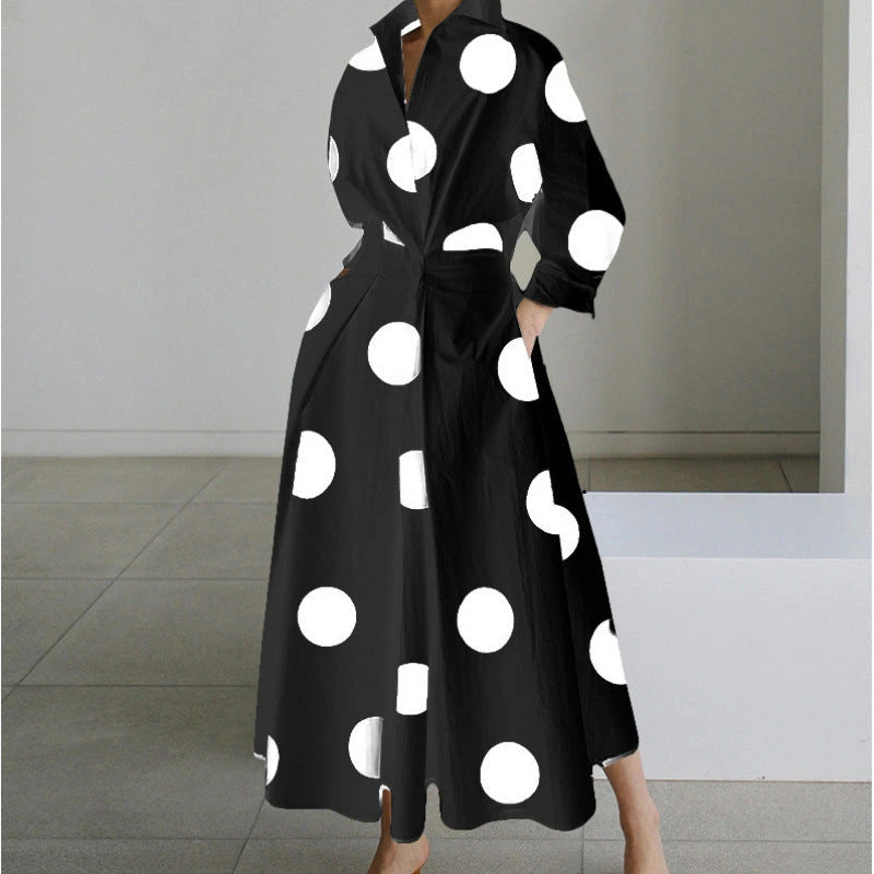 Woman wearing a black polka front wrap collared maxi dress - lifestyle photo
